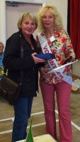 Carol O'Brian receives the Rose Wood Trophy for the best single rose