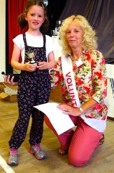 Matilda Irving receives the cup for children's handicrafts from Show President