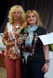 Winner of the Menston Show Photography Cup, Petronela Prisca, receives the trophy from Show President Cllr Sue Rix