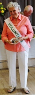 Elizabeth Loy holding one of the two trophies she won, the Rose Wood Trophy for a single rose